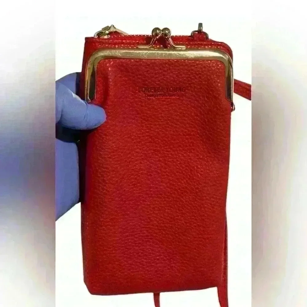 A Forever Young red woman’s,Crossbody bag / wallet with attached iPhone carrier.